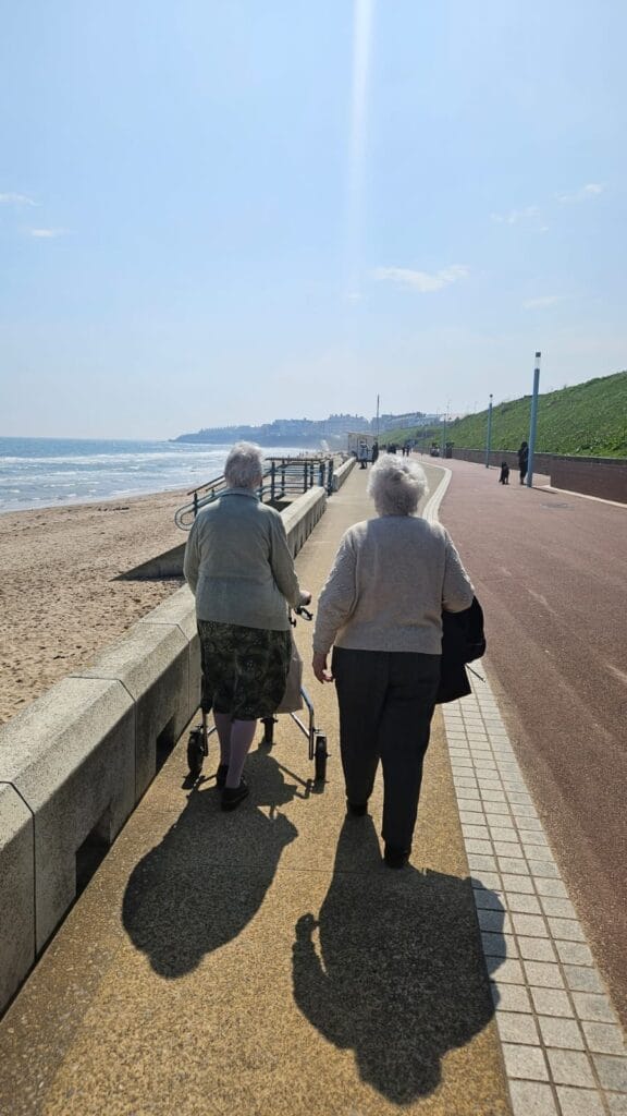 Walking along the seafront in Whitley Bay