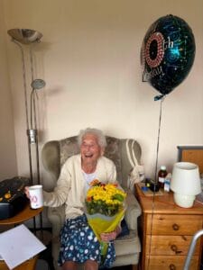 Arden House resident enjoying a laugh on her 100th Birthday